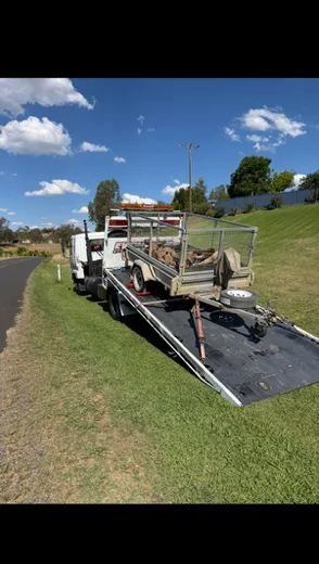 Loaded trailer secured on the Evolution tilt tray in the countryside