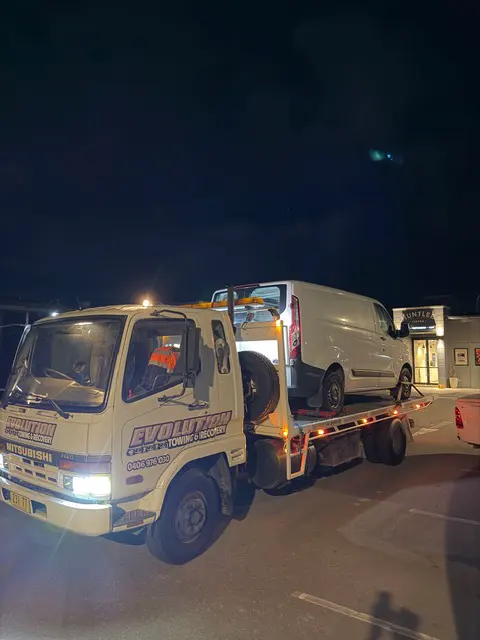 Work van secured on the tilt tray during a night callout